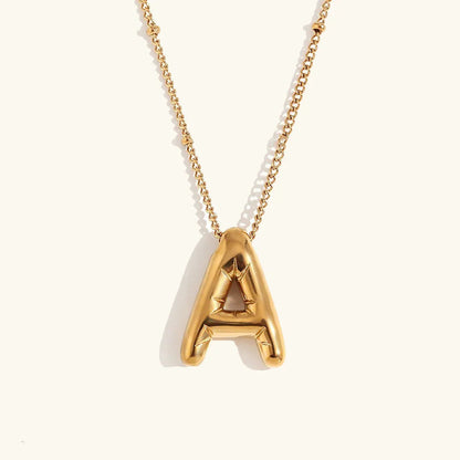 Gouden ketting met ballon-initiaal
