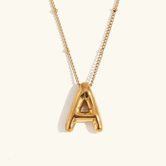 Gouden ketting met ballon-initiaal