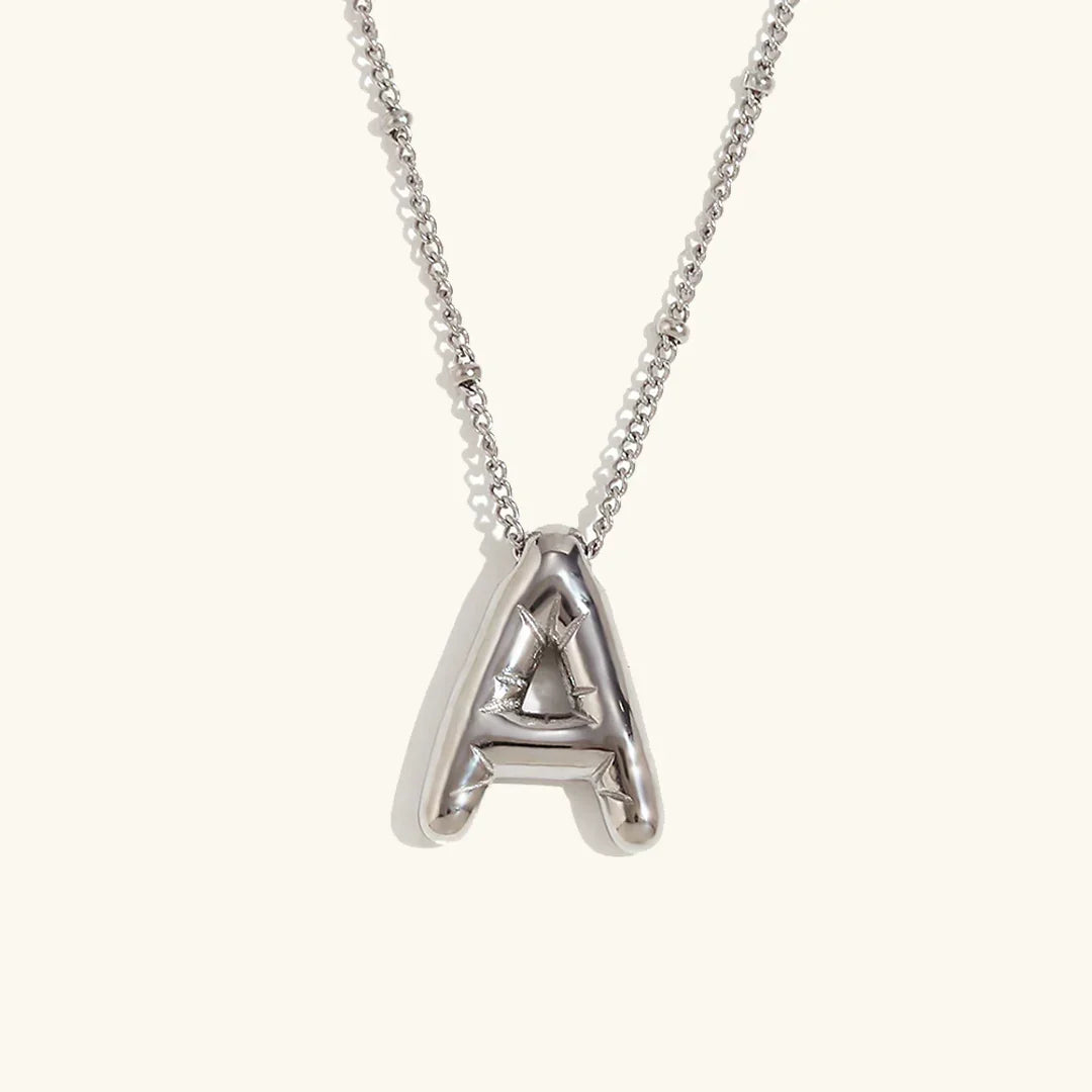 Gouden ketting met ballon-initiaal