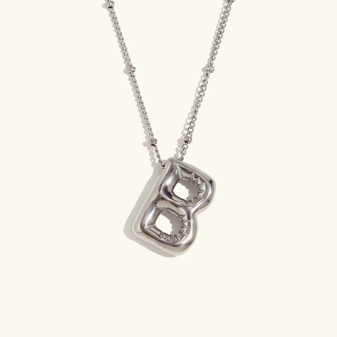Gouden ketting met ballon-initiaal