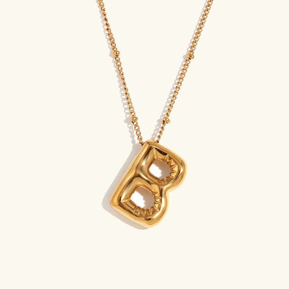 Gouden ketting met ballon-initiaal