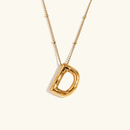 Gouden ketting met ballon-initiaal