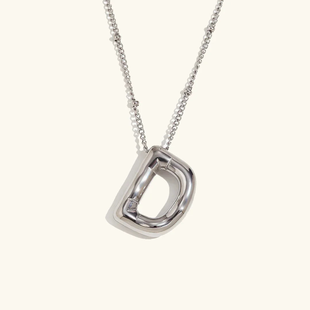 Gouden ketting met ballon-initiaal