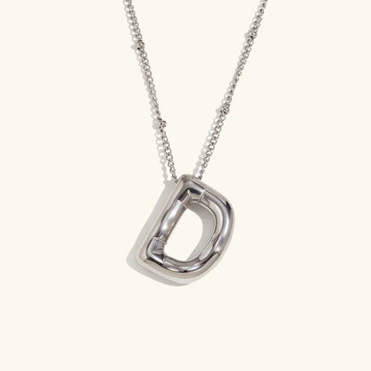 Gouden ketting met ballon-initiaal