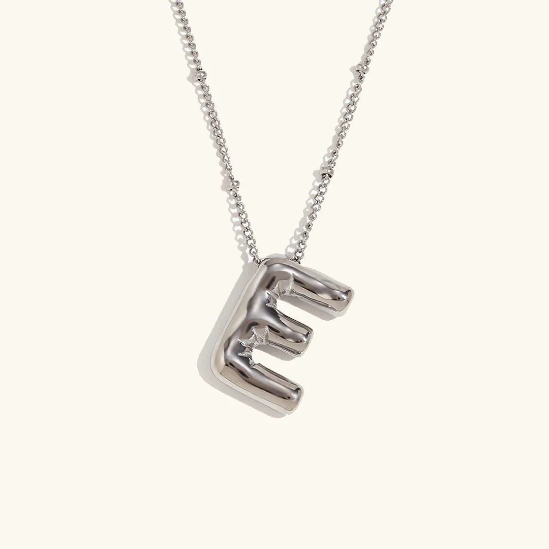 Gouden ketting met ballon-initiaal