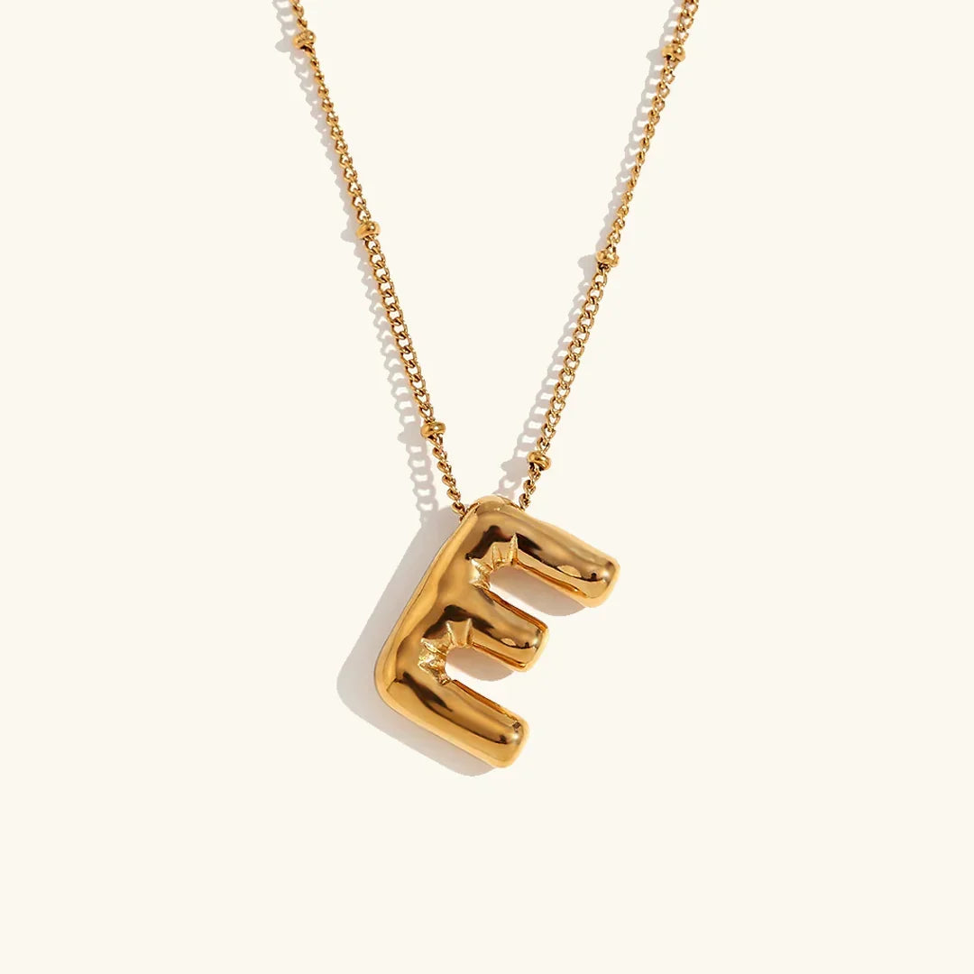 Gouden ketting met ballon-initiaal