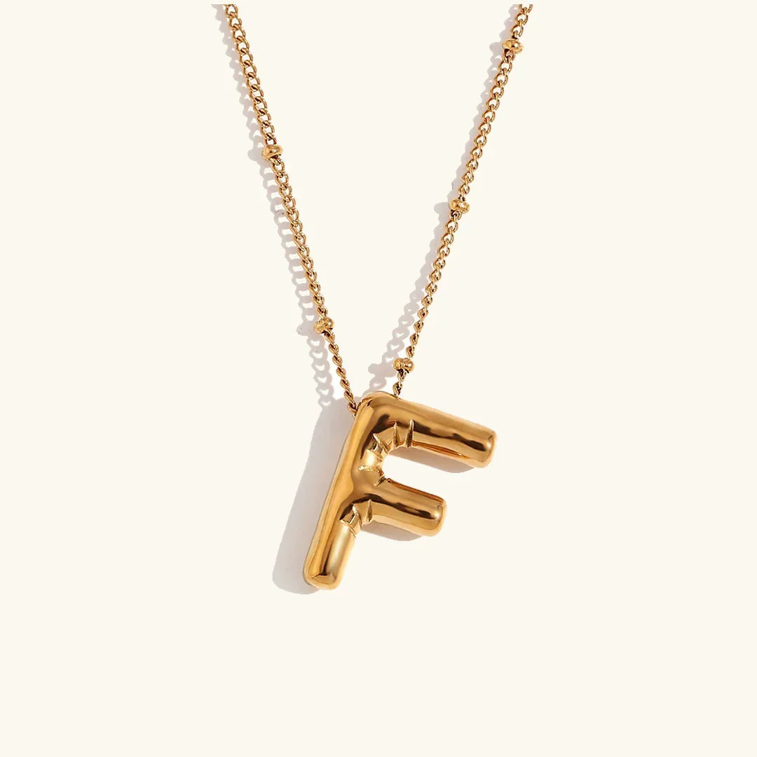Gouden ketting met ballon-initiaal