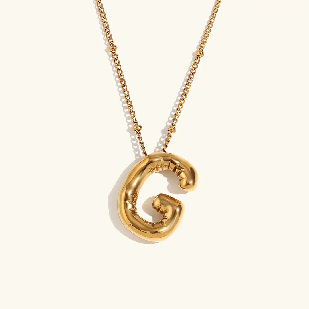 Gouden ketting met ballon-initiaal