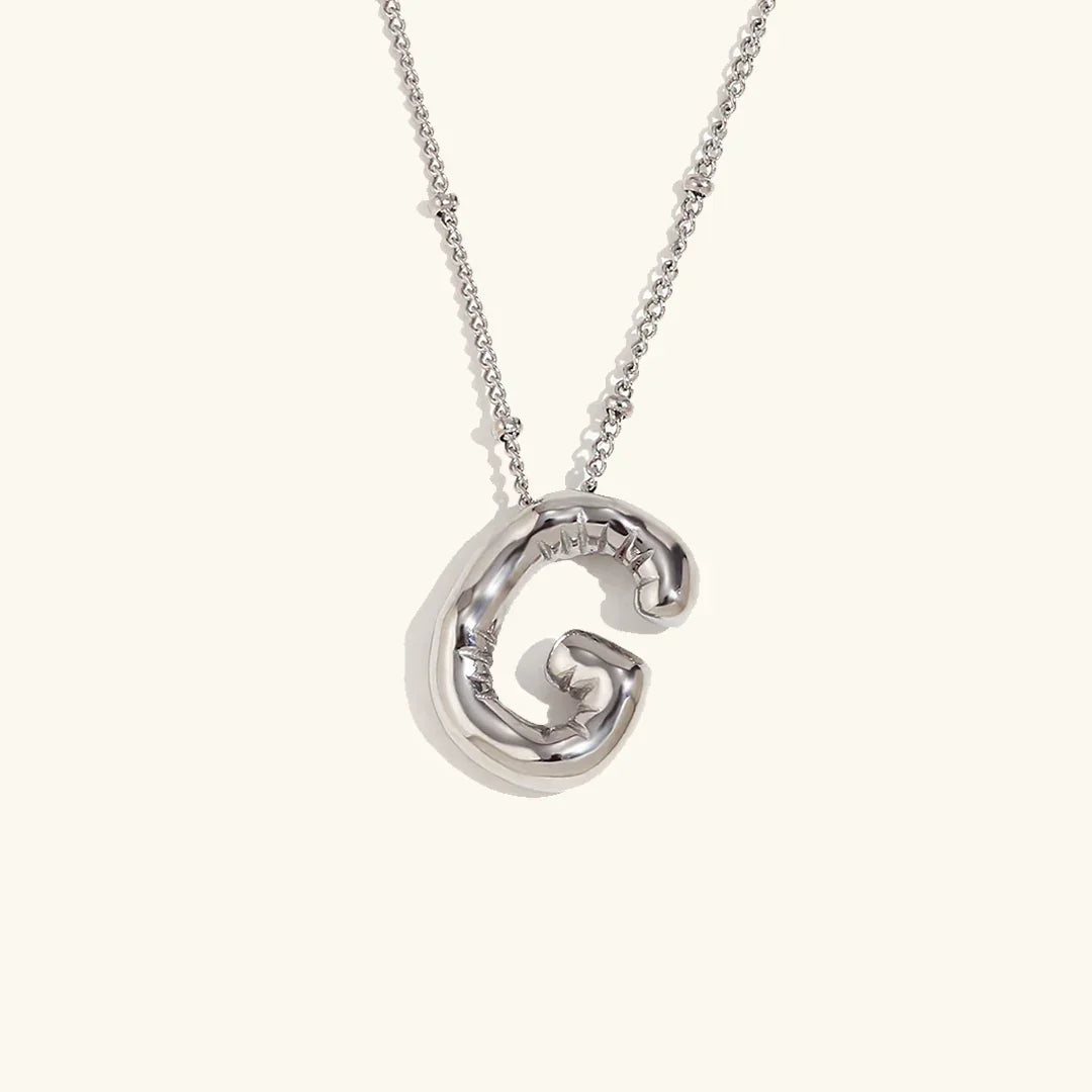 Gouden ketting met ballon-initiaal