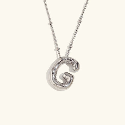 Gouden ketting met ballon-initiaal
