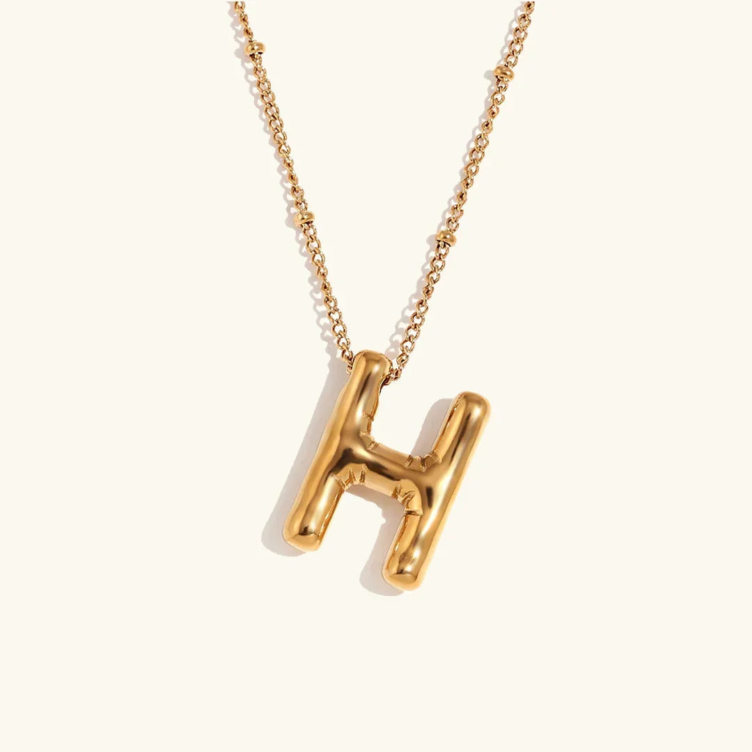 Gouden ketting met ballon-initiaal