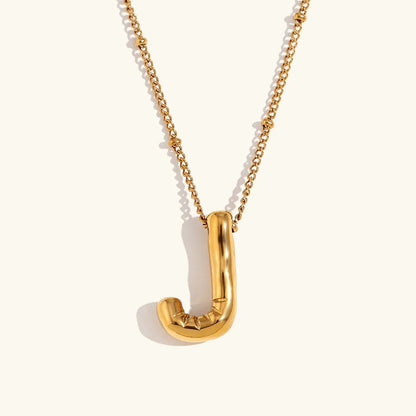 Gouden ketting met ballon-initiaal