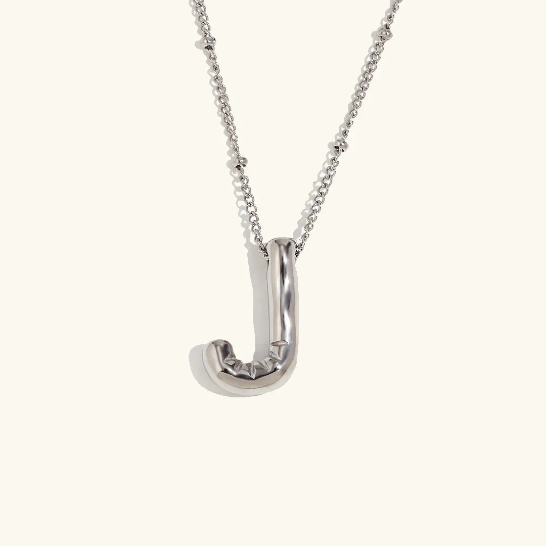 Gouden ketting met ballon-initiaal