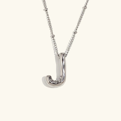 Gouden ketting met ballon-initiaal