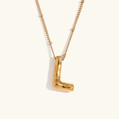 Gouden ketting met ballon-initiaal