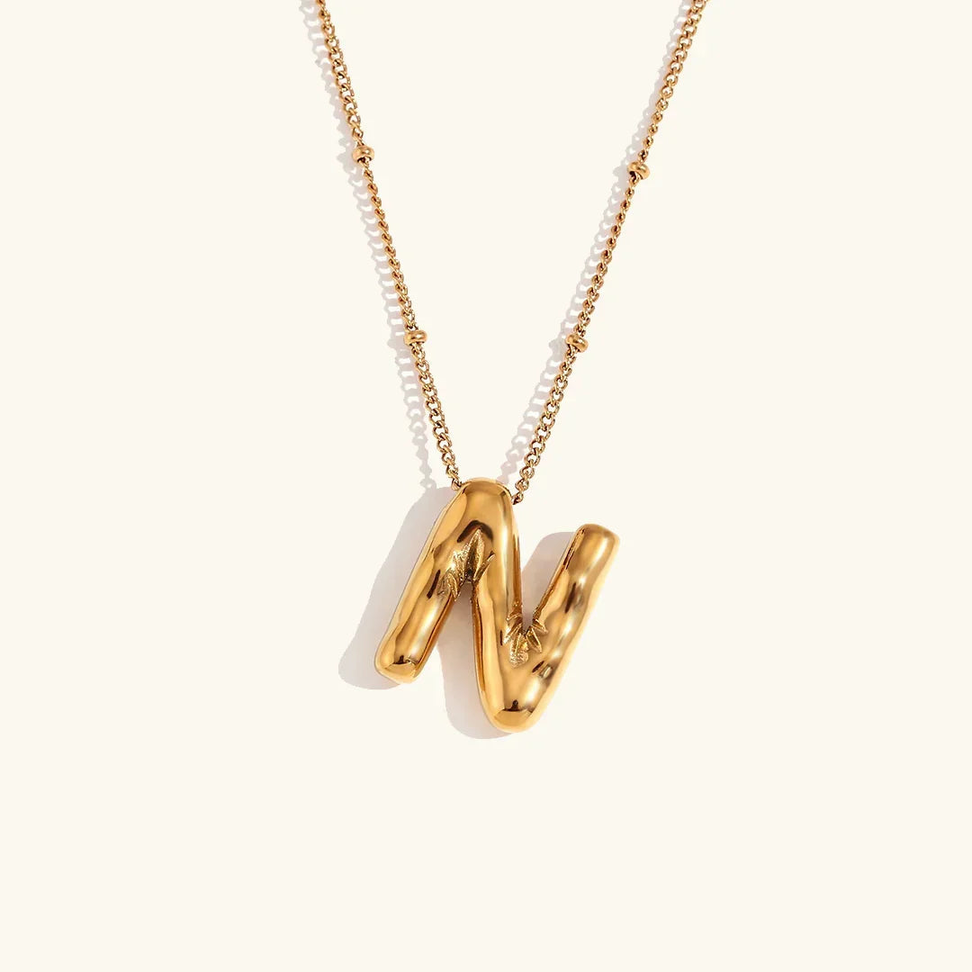 Gouden ketting met ballon-initiaal