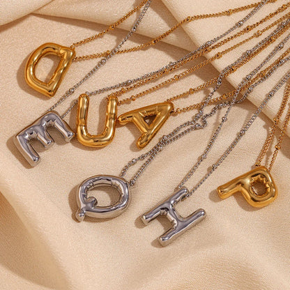 Gouden ketting met ballon-initiaal