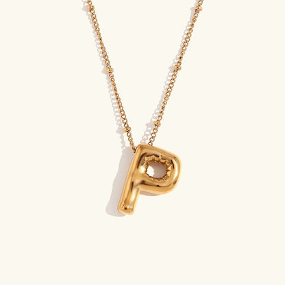 Gouden ketting met ballon-initiaal