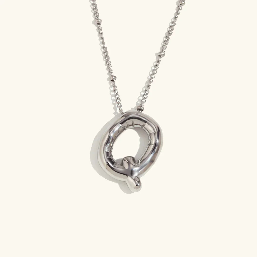 Gouden ketting met ballon-initiaal