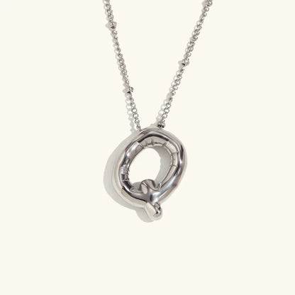 Gouden ketting met ballon-initiaal