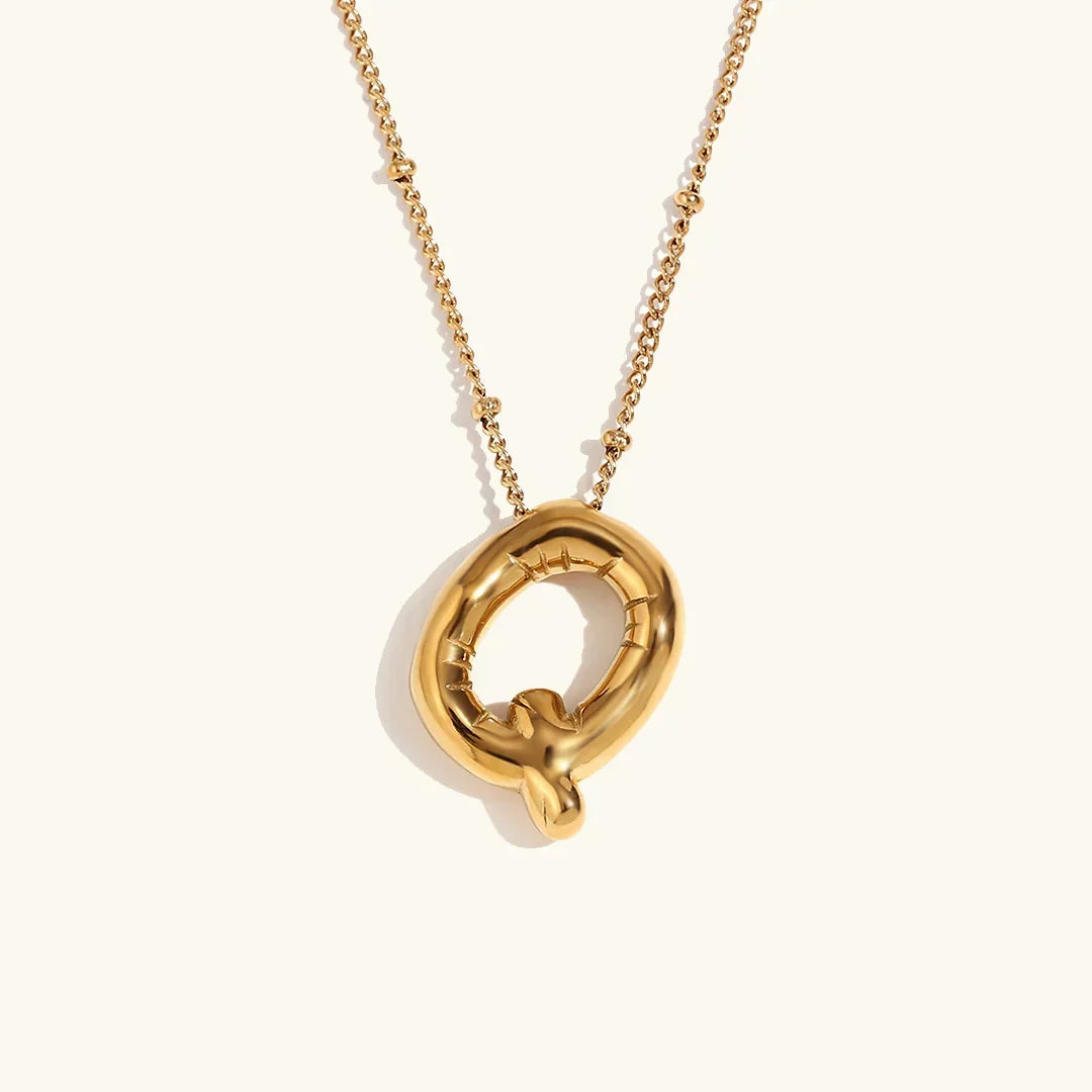 Gouden ketting met ballon-initiaal