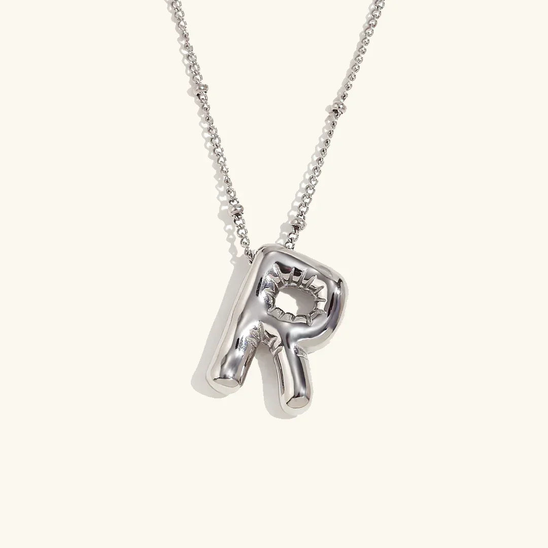 Gouden ketting met ballon-initiaal
