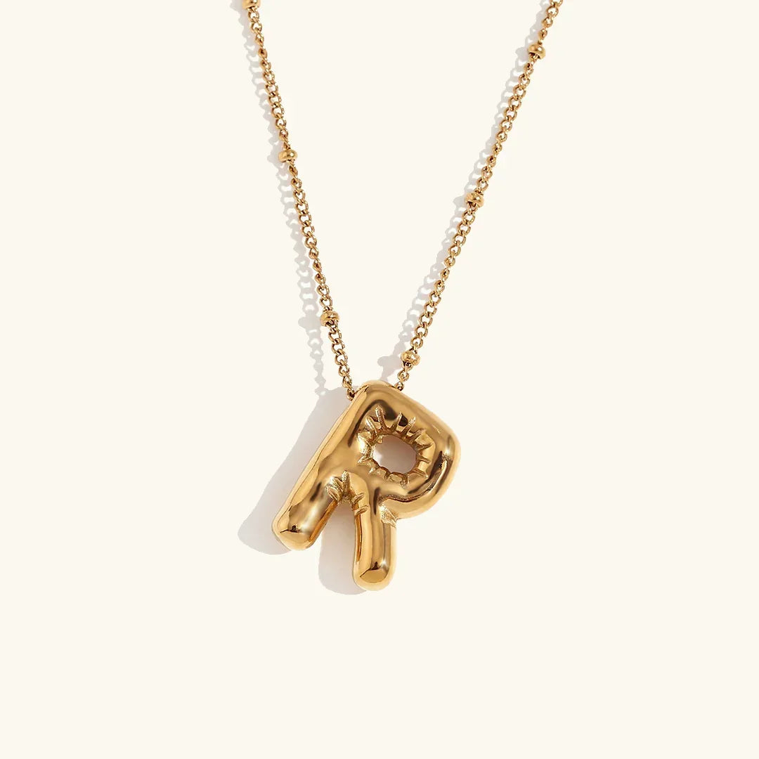 Gouden ketting met ballon-initiaal