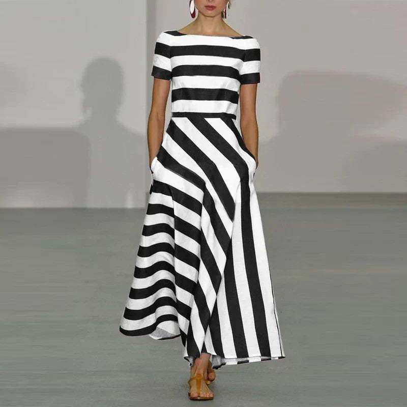 JULIE MAXI JURK – MODERN STREEP MET ELEGANTE UITSTRALING