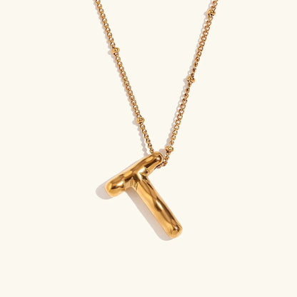 Gouden ketting met ballon-initiaal