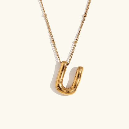 Gouden ketting met ballon-initiaal