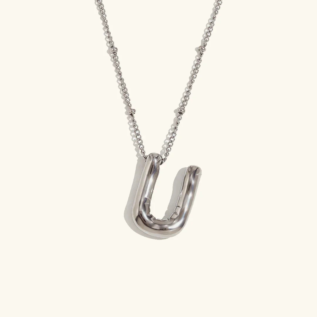 Gouden ketting met ballon-initiaal