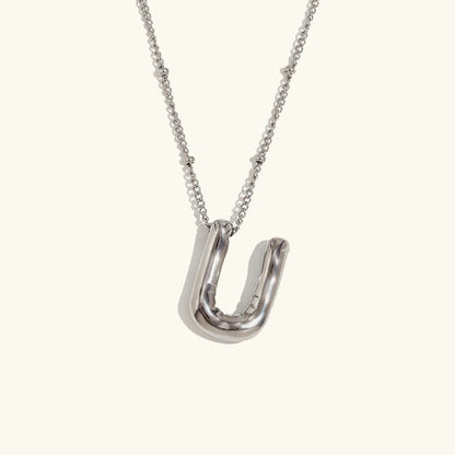 Gouden ketting met ballon-initiaal