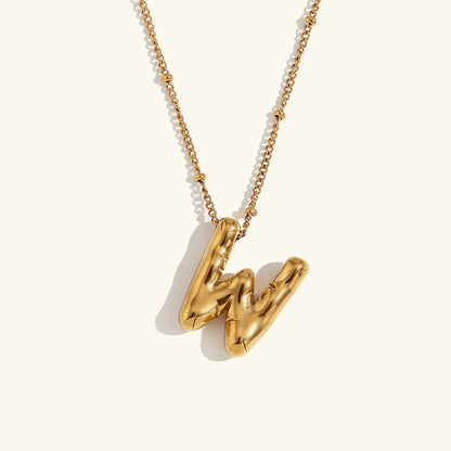 Gouden ketting met ballon-initiaal