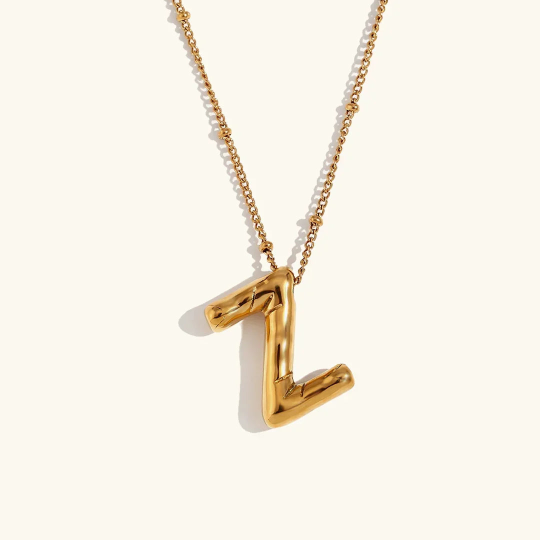 Gouden ketting met ballon-initiaal